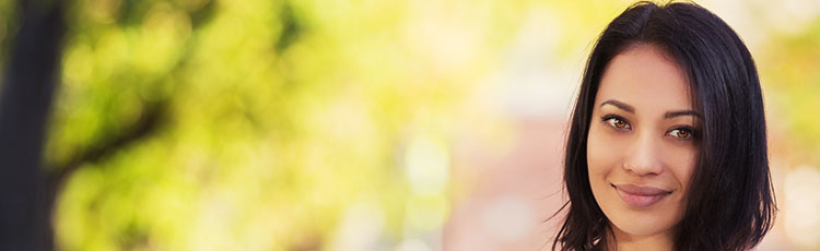 Smiling woman with medium-length black hair