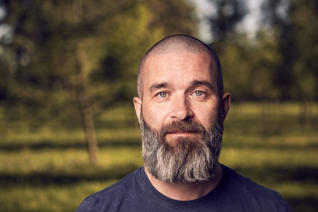 man outdoor with a beard and buzz haircut