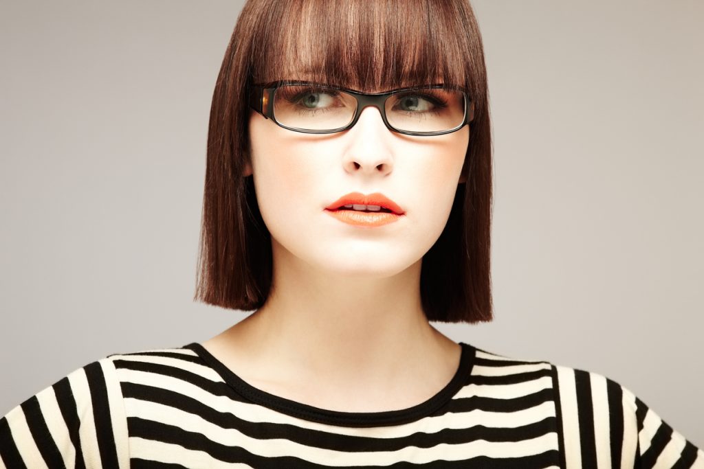 brunette woman blunt short hair bangs fringe our favorite bob haircuts for thin hair toppik hair blog
