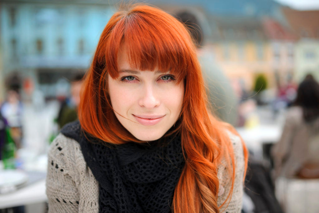 redhead bangs woman long oblong face hairstyles face shapes toppik blog post
