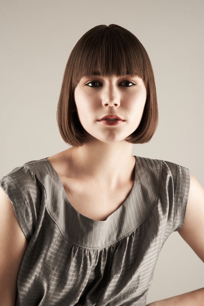 brunette woman curled under bob short hairstyle our favorite bob haircuts for thin hair toppik hair blog