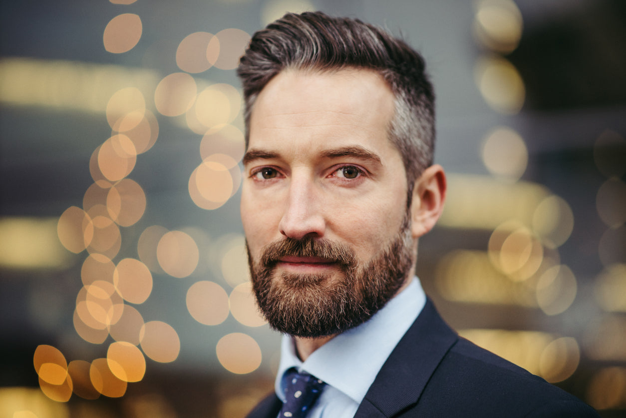 Man in a suit with a well-groomed beard