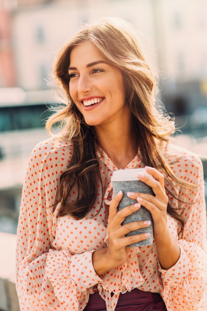 brunette woman long beachy waves our favorite wavy hairstyles toppik hair blog