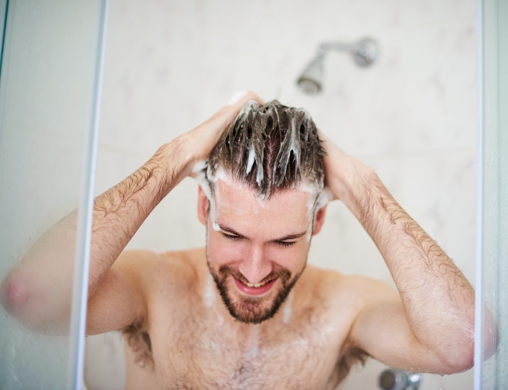 shower man washing hair shampoo conditioner when is hair conditioner for men necessary toppik hair blog
