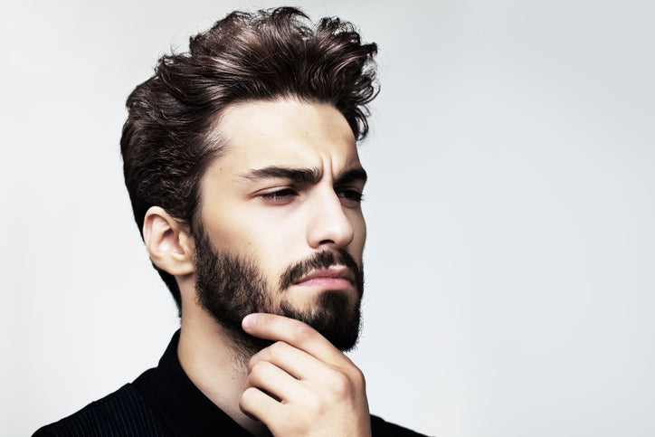 Man with luscious hair and a beard.