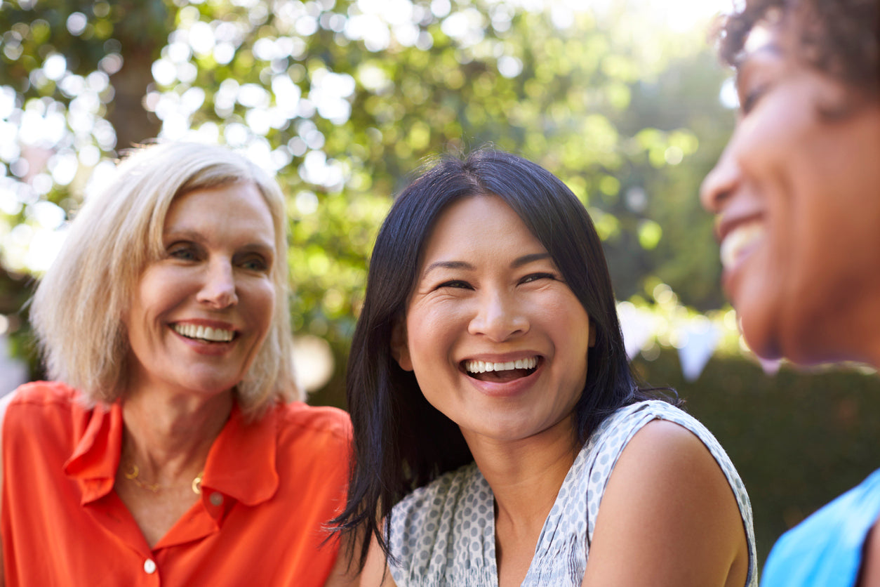 Three women outdoor smiling