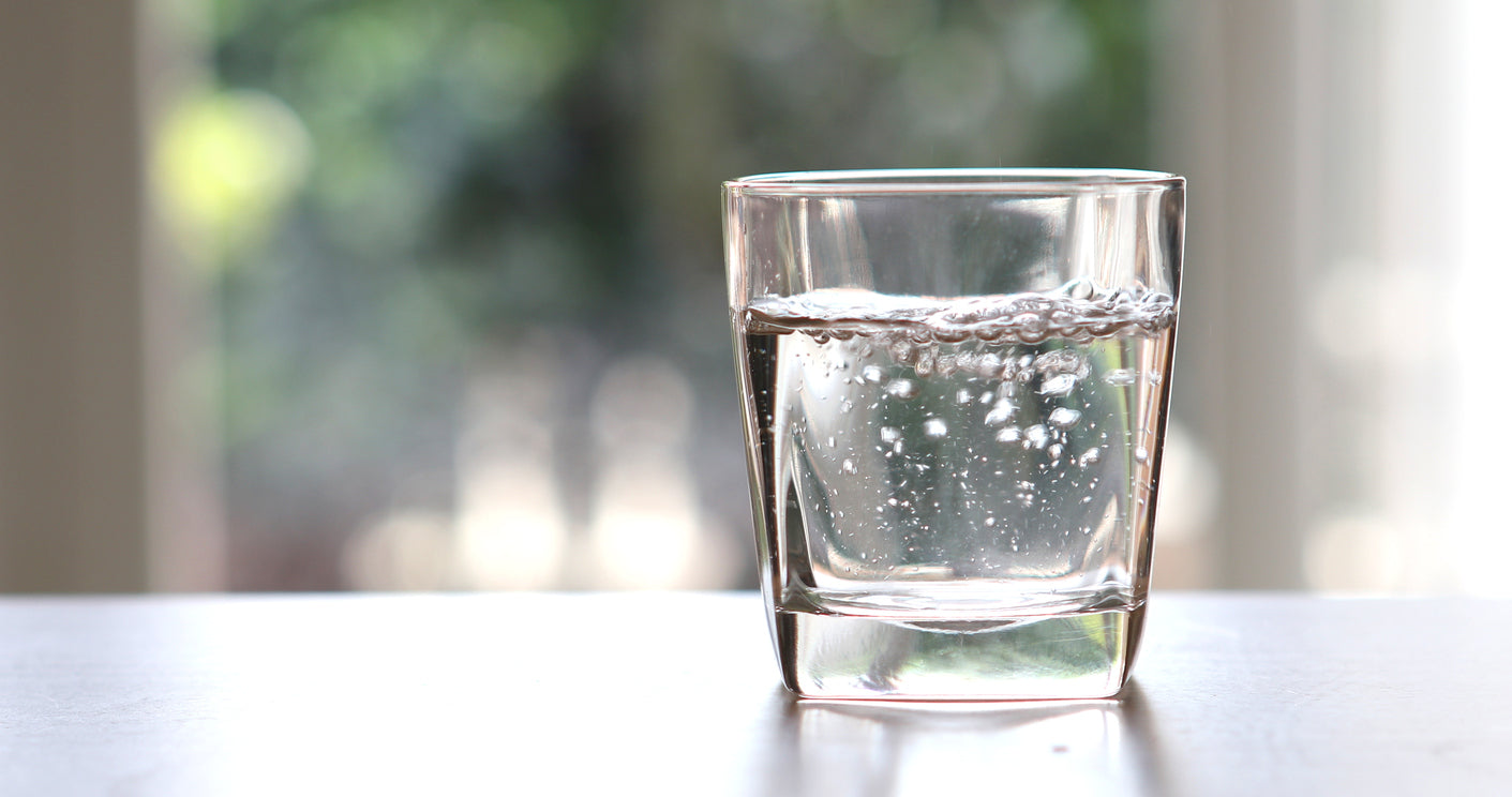 a glass of water on top of the counter