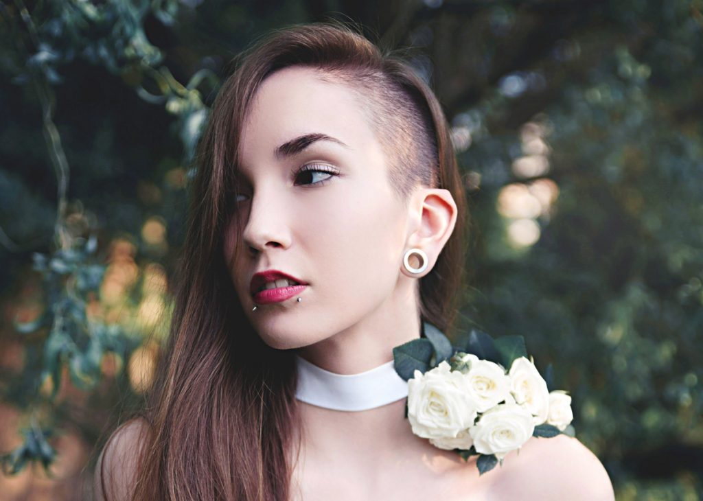 woman has a Classic Side Shave in her long brown hair
