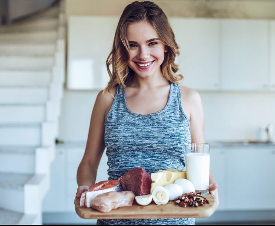woman smiling mirror african american natural curly hair understanding the anatomy of hair toppik hair blog