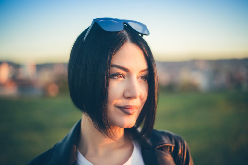 sleek blunt bob haircut woman black brown hair sunglasses our favorite bob haircuts for thin hair toppik hair blog