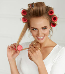rollers-blonde-woman-happy-avoid-heat-damaged-hair