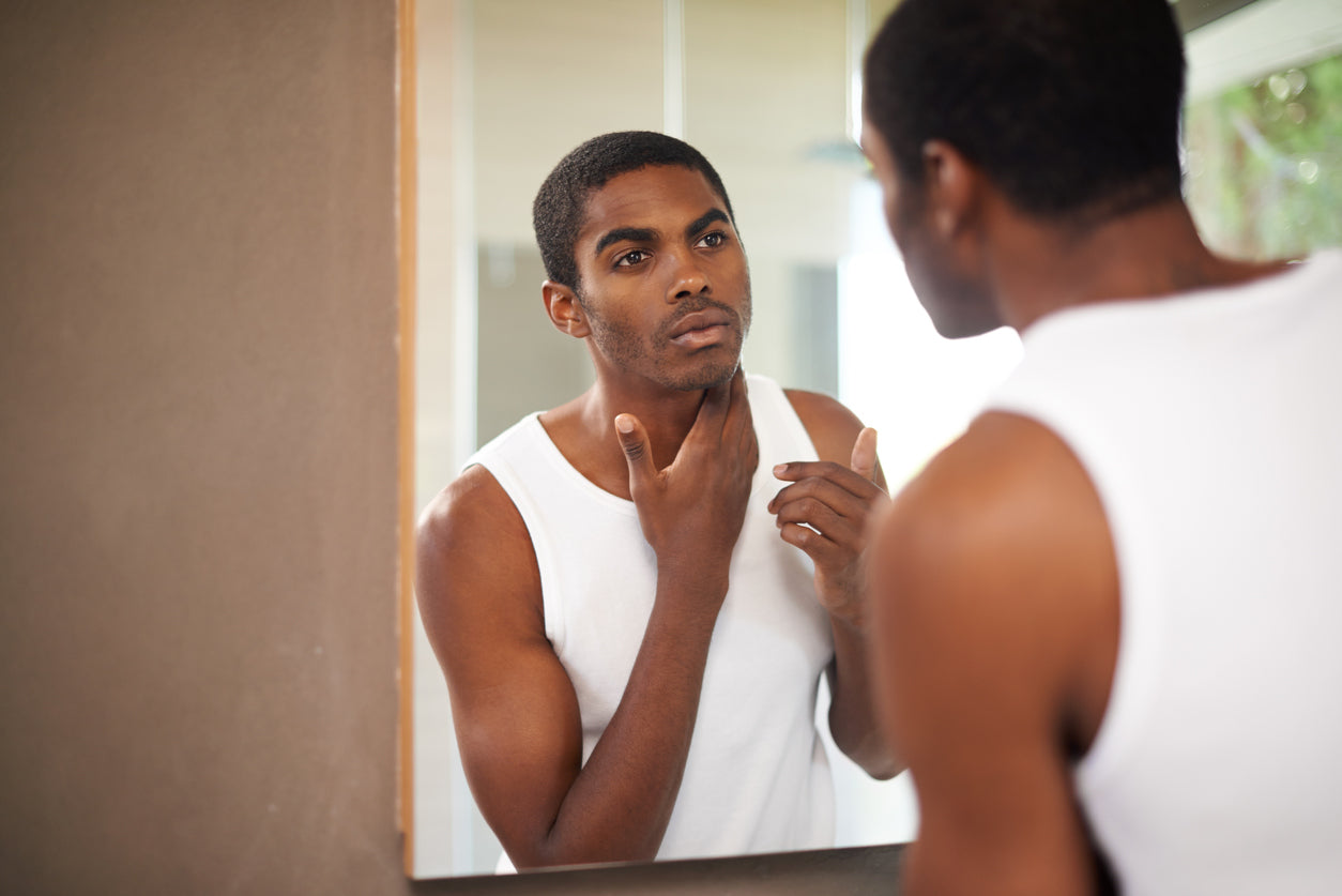 Man looking at the mirror