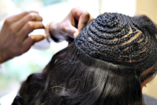Woman having her weave Sew-In Extensions