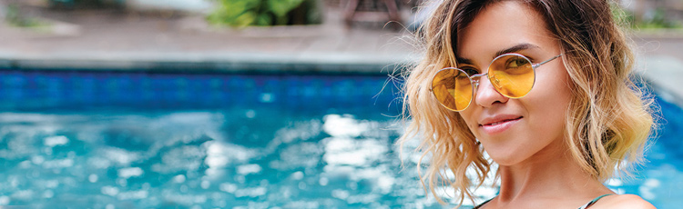pool summer blonde girl sunglasses happy warm weather haircuts for summer hair toppik hair blog