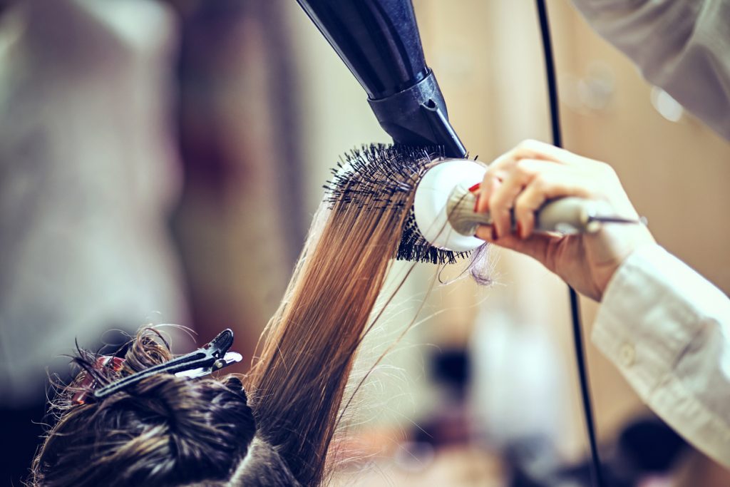 blow dry hair salon closeup round brush clips how to deal with humidity hair toppik hair blog